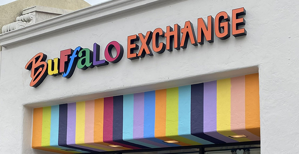 Storefront of Buffalo Exchange Pasadena with Rainbow Lettering and Painted Stripes