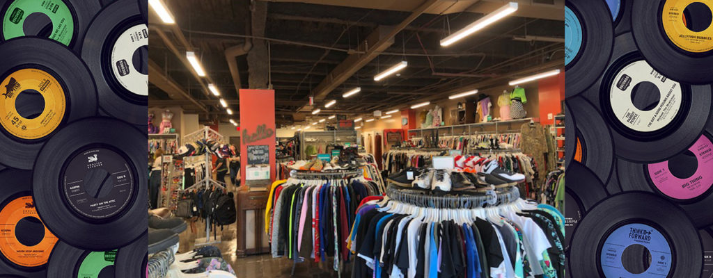 Inside view of Buffalo Exchange Nashville framed by two photos of 12" vinyl records