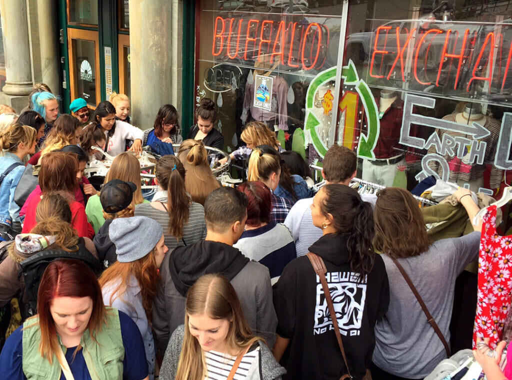 Small crowd of people outside of a Buffalo Exchange