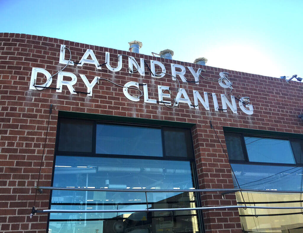 Sign saying laundry and dry cleaning