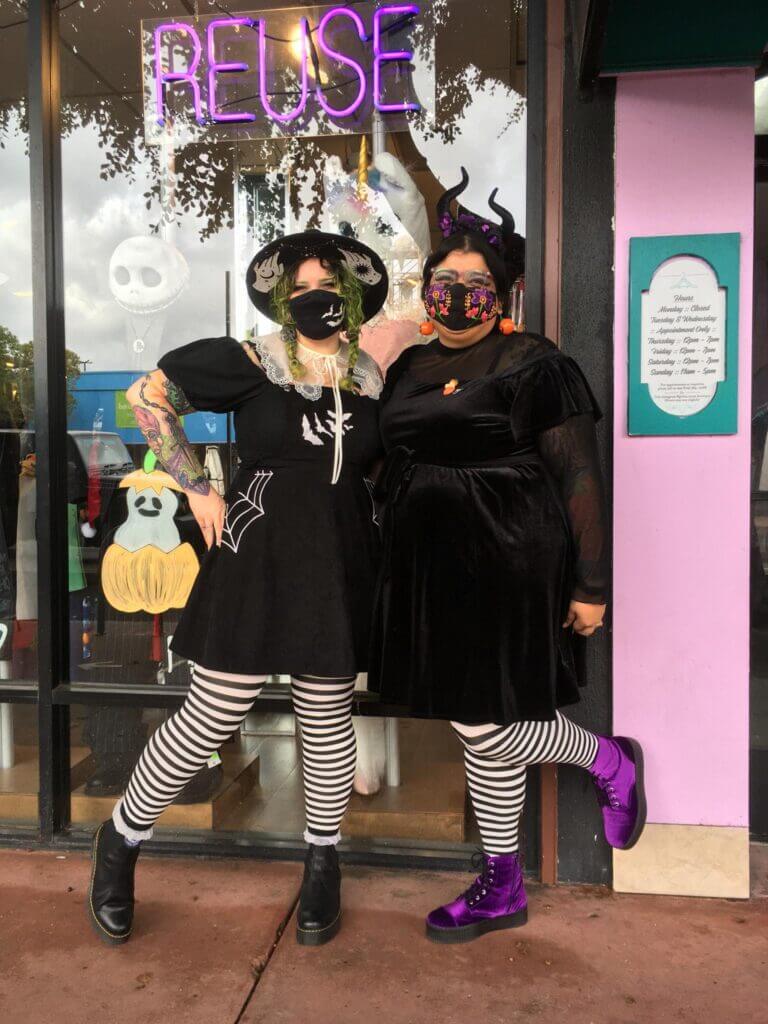 Two Buffalo Exchange employees dressed as witches