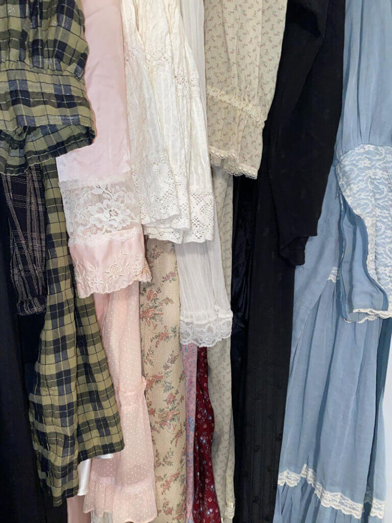 Close up of the sleeves of a few vintage dresses