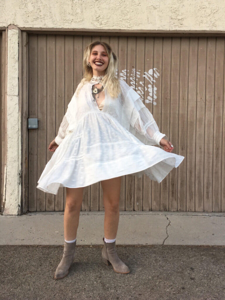 a person wearing a flowy white dress