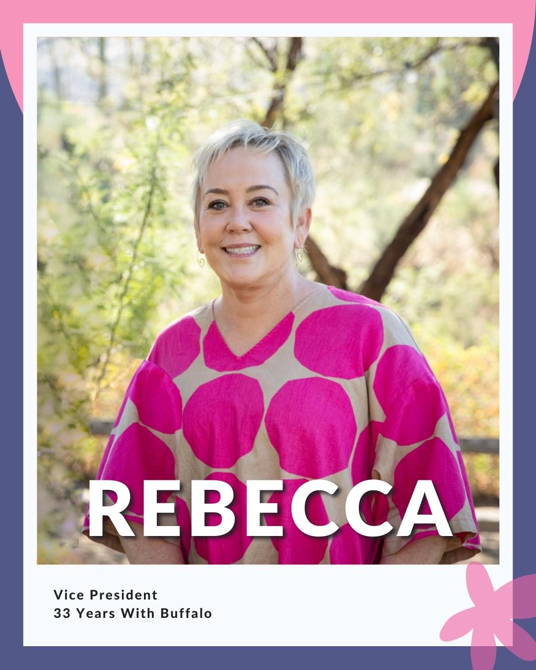 Rebecca wearing a block printed top with pink circles; reads Vice President - 33 Years With Buffalo