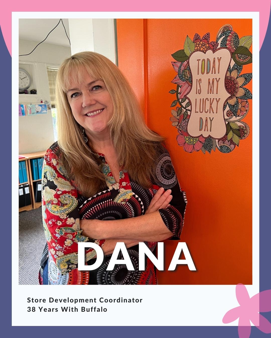 Dana in front of orange door Dan wearing printed blouse and jeans in front of orange door; reads Store Development Coordinator - 38 Years With Buffalo