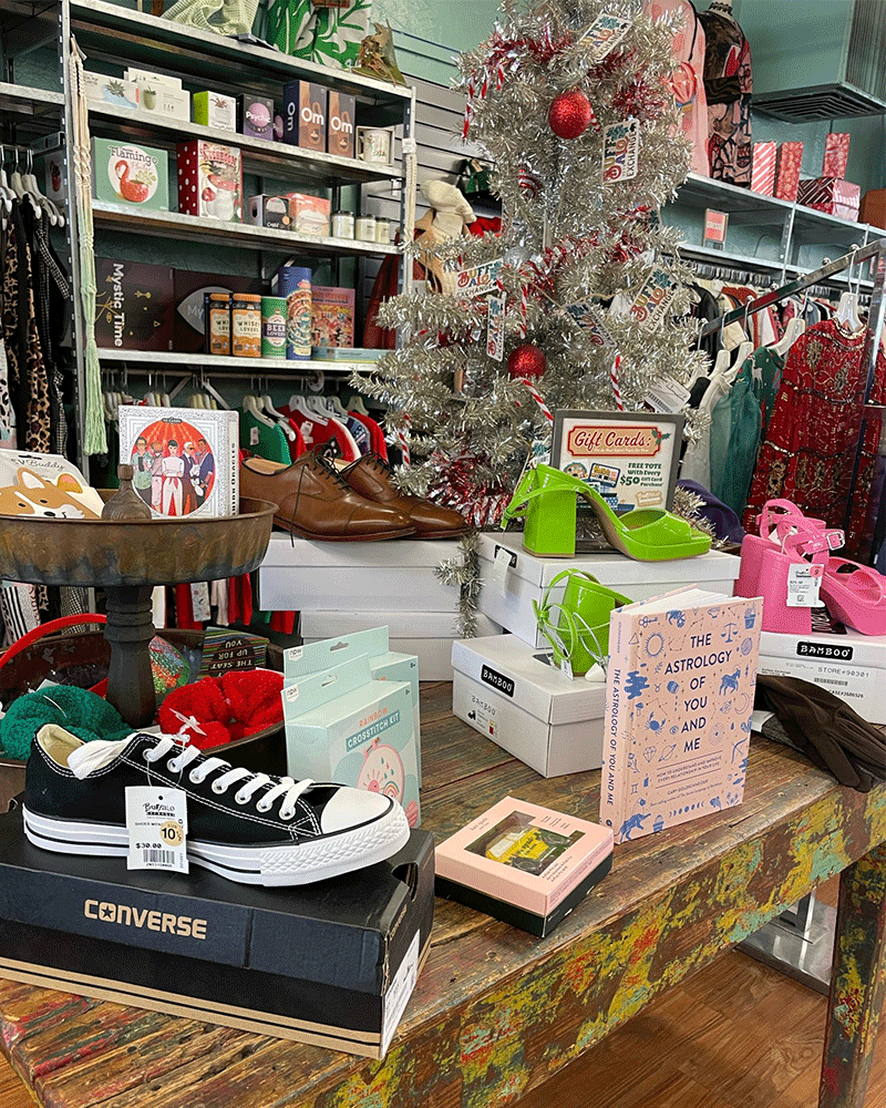 Table holding shoes, small gifts and miniature Christmas tree