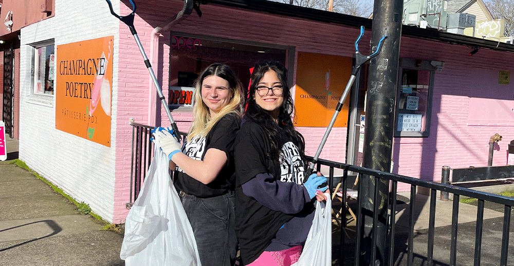 Buffalo exchange employees posing with trash pickers