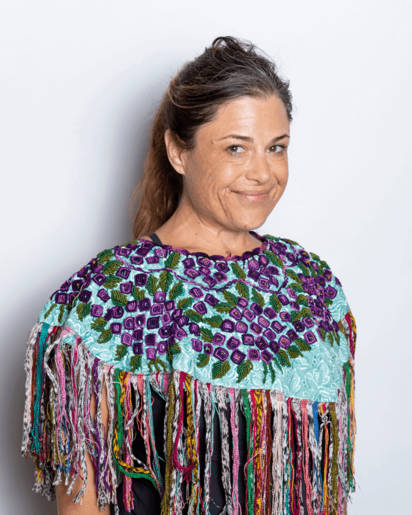 Denise wearing an embroidered multi-colored shawl