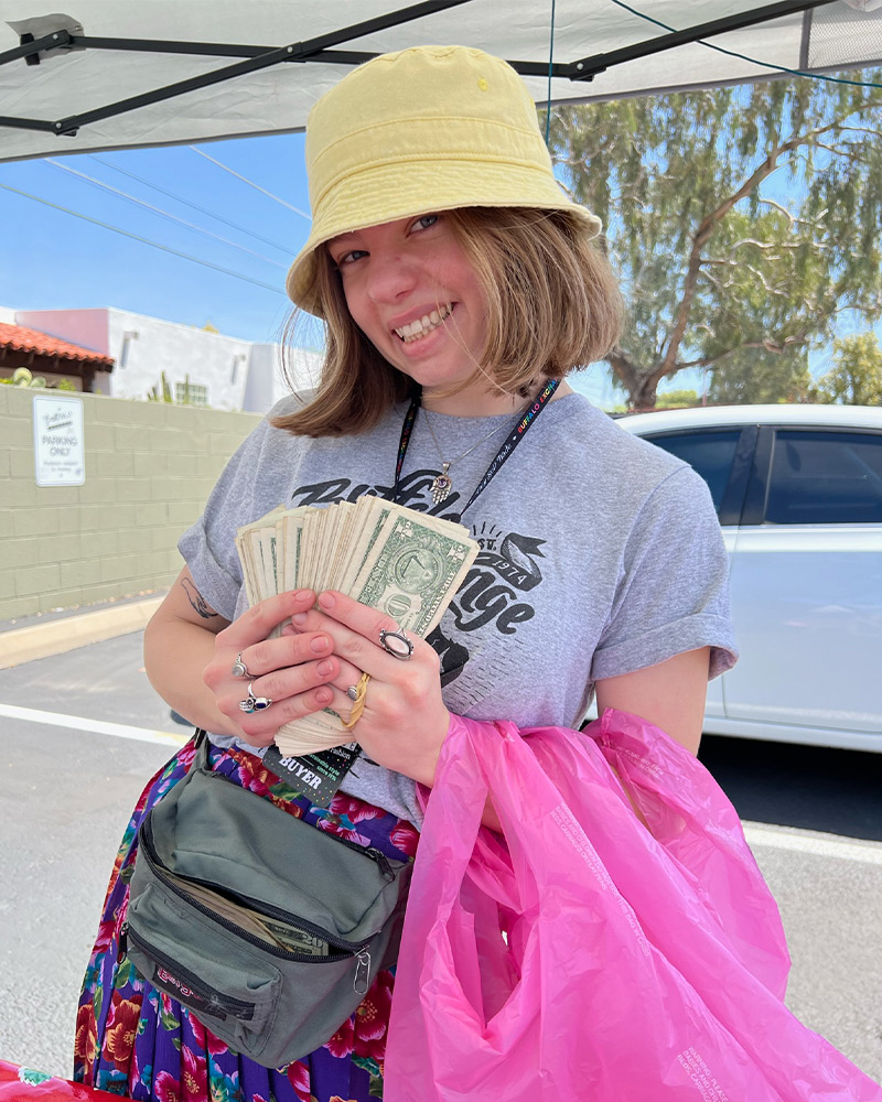 Dollar Bills Buffalo Cashier showing off dollar bills