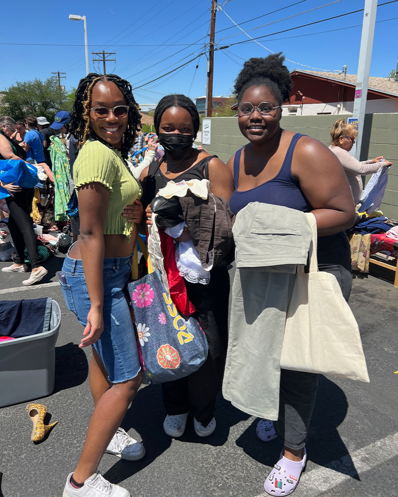 $1 Sale customers Group of three friends shopping the $1 sale