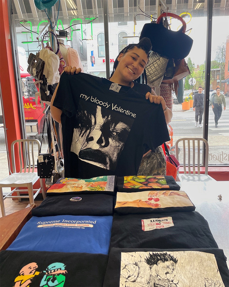 Employee holding up a vintage tee