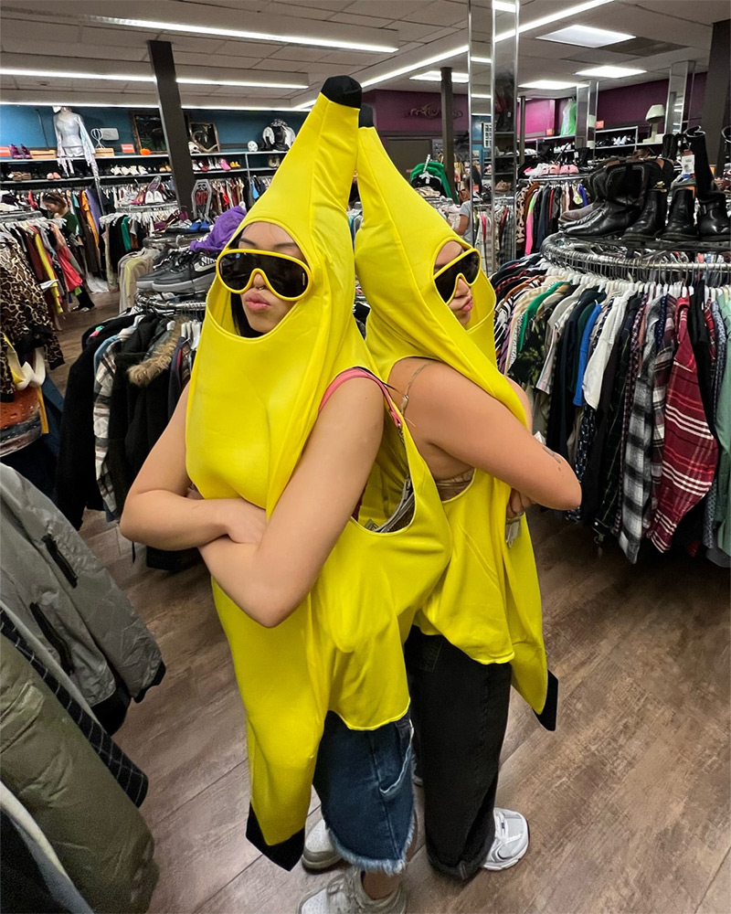 Two people wearing banana costumes