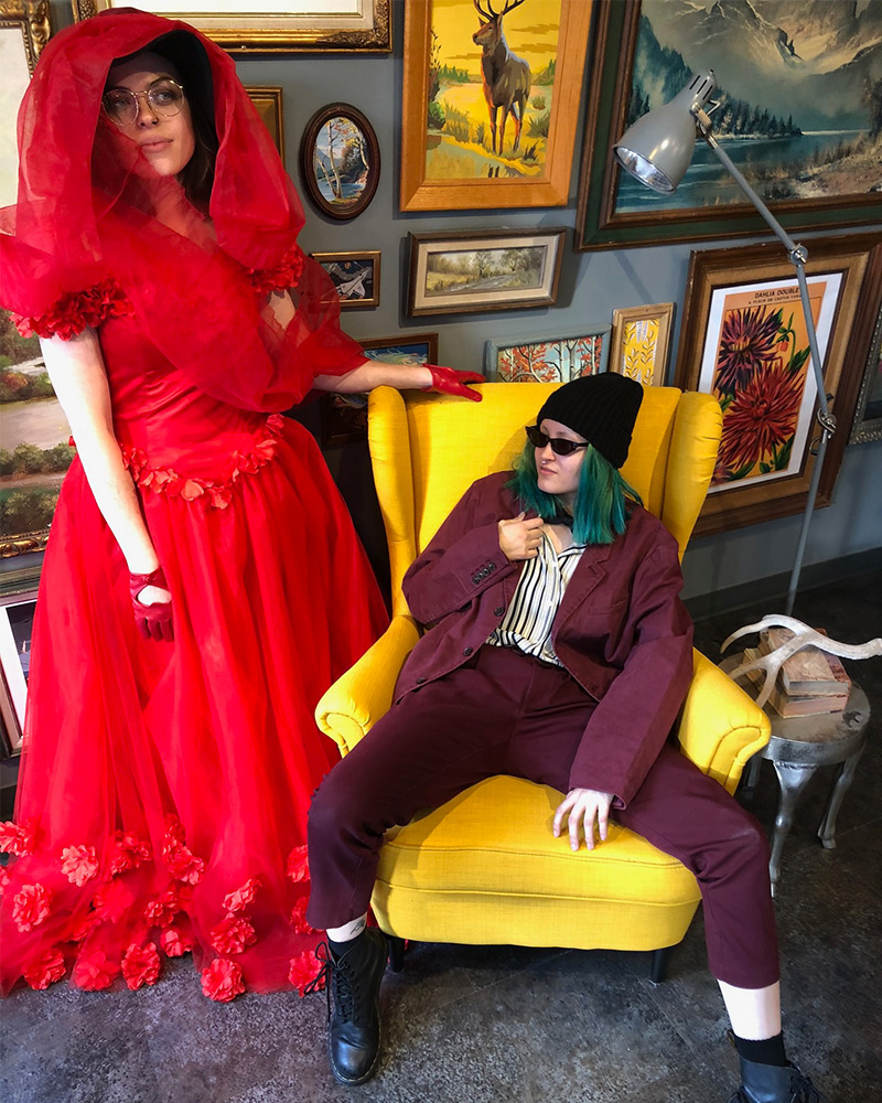 Halloween costumes of red bride Lydia Deetz and burgundy suited Beetlejuice