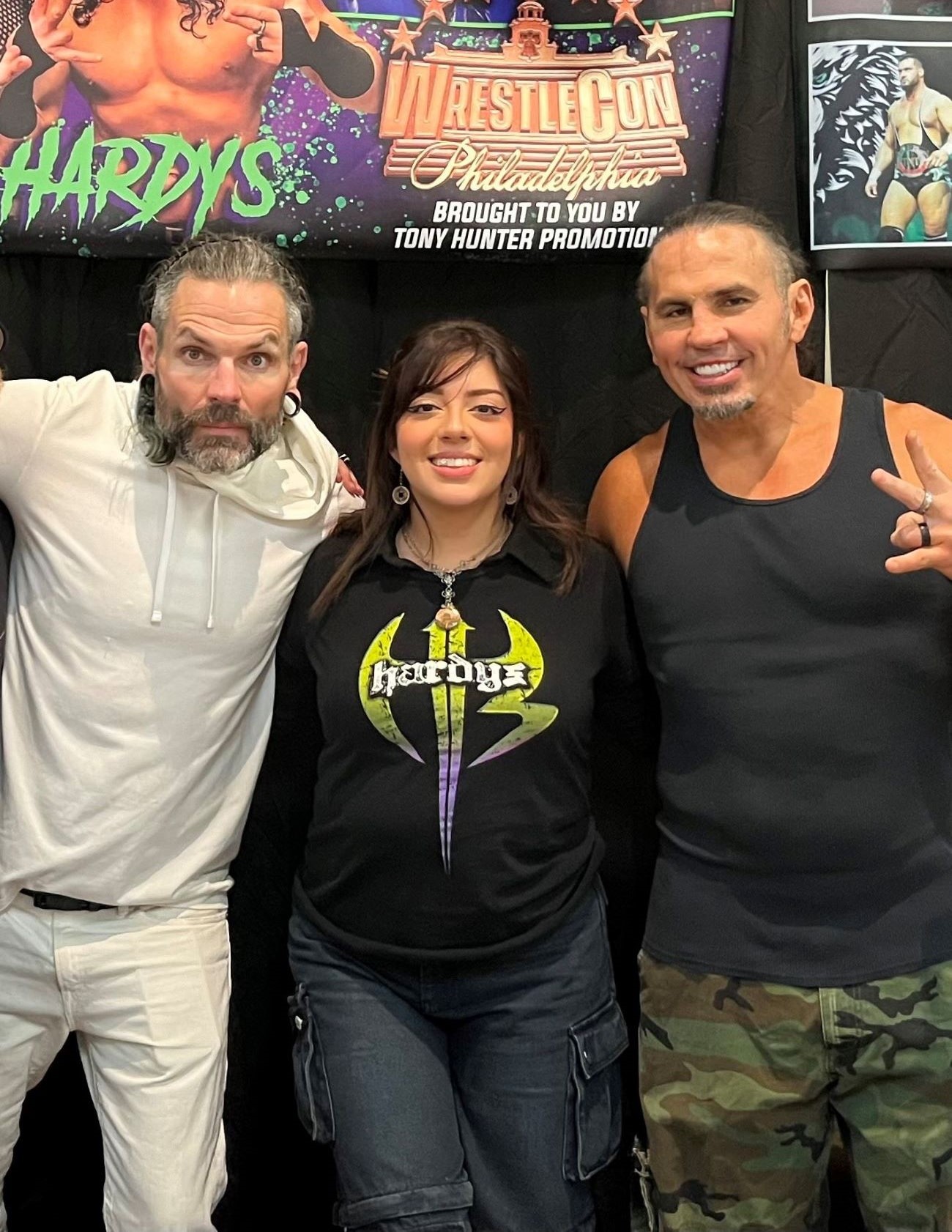 Daniella standing next to Jeff and Matt Hardy