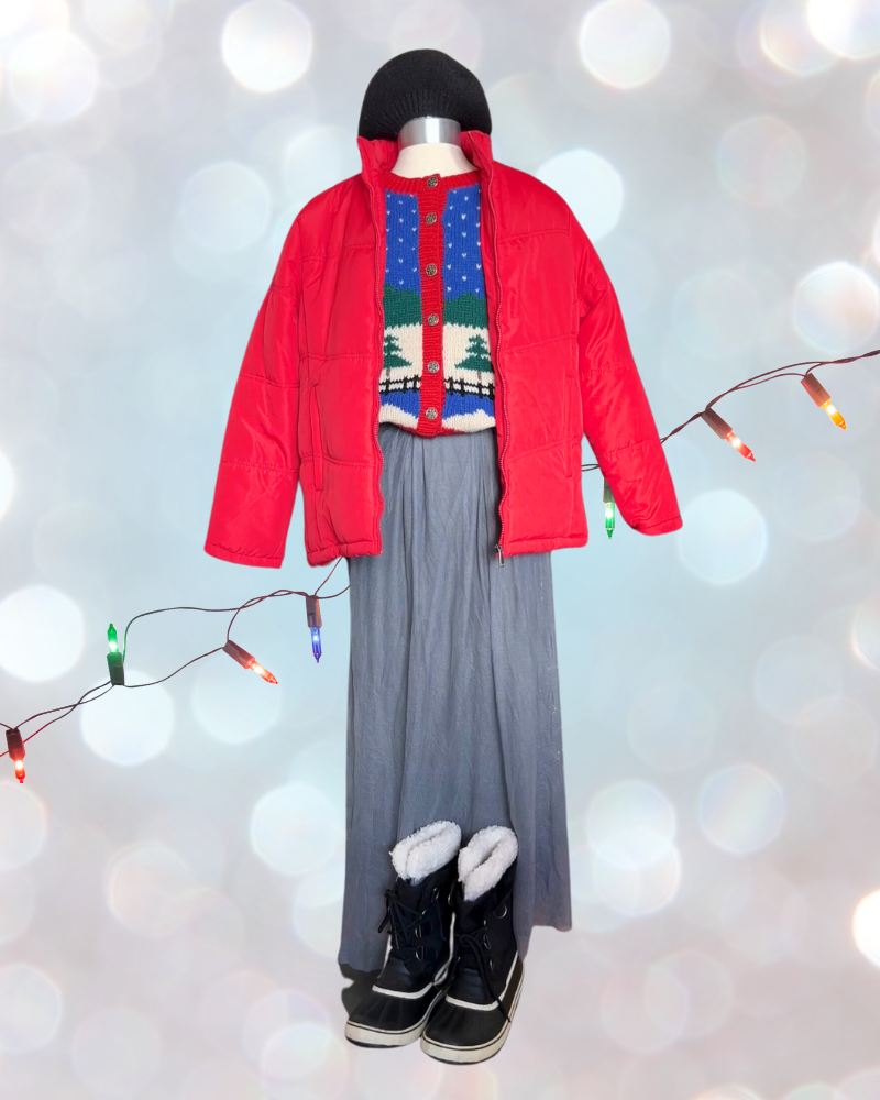 Mannequin wears knit sweater, gray maxi skirt, red puffer jacket and black snow boots with black beret