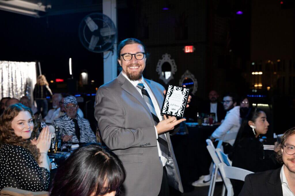 man winning award