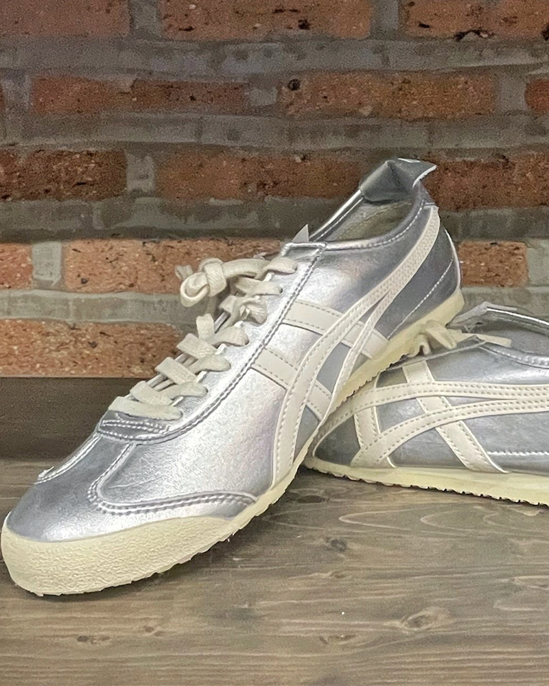 Blog-12-Edited Silver Onitsuka Tiger sneakers against a brick wall