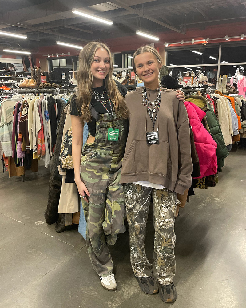 Blog-29-Edited Two women wearing camouflage pants standing in middle of clothing store