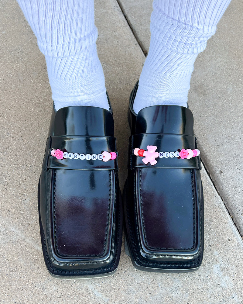 Blog-5-Edited Patent leather loafers with decorated with white and pink beads that spell "Martine Rose"