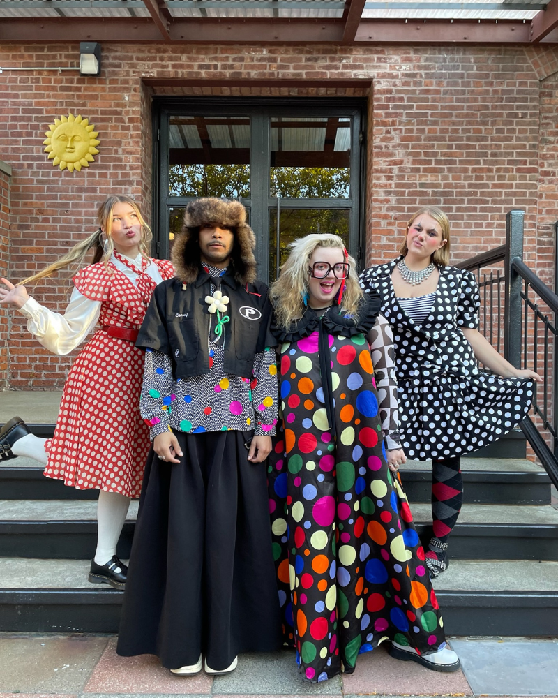Clown Halloween group costume of four people wearing polka dots 
