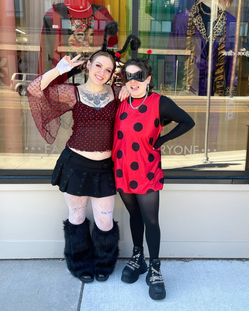 Two Buffalo Employees in polka dots with antennae, posing outside the store.