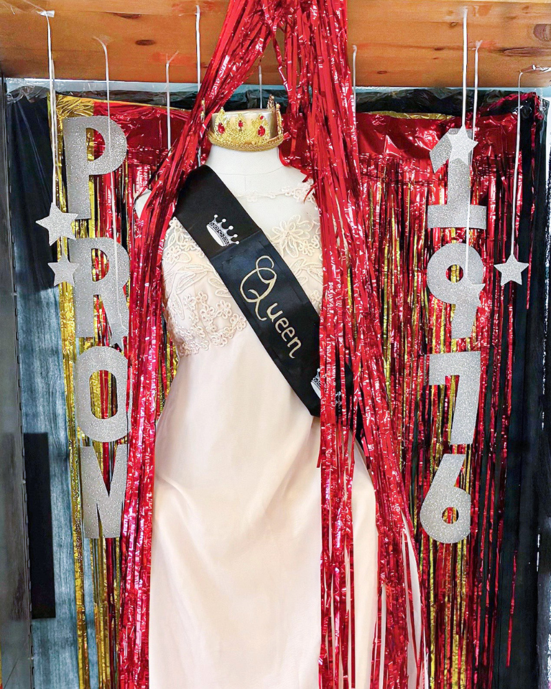 Mannequin in white dress with Prom Queen sash