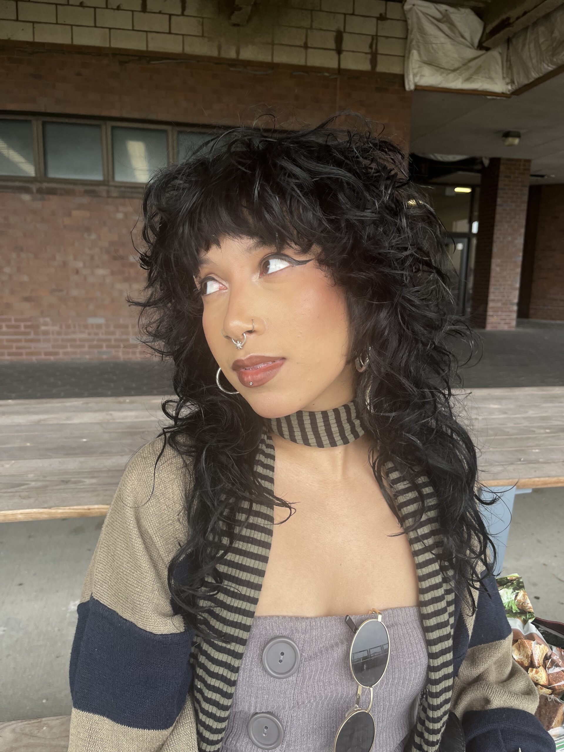Buffalo Exchange employee Kat standing in front of a building